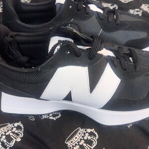 Almost brand  new New balance Black and White Women's Athletic Shoes